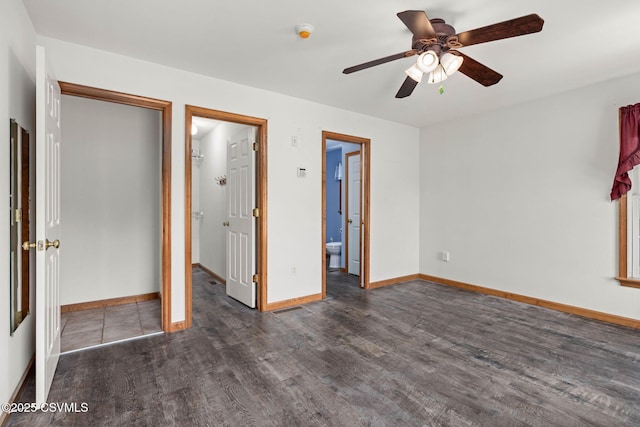 620 Sunset Dr, Bloomsburg, PA 17815 - unfurnished bedroom with wood finished floors, baseboards, a spacious closet, ensuite bath, and ceiling fan
