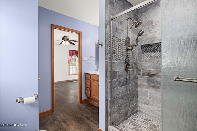 620 Sunset Dr, Bloomsburg, PA 17815 - bathroom with vanity, a shower stall, wood finished floors, and baseboards