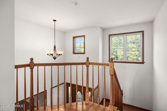 620 Sunset Dr, Bloomsburg, PA 17815 - staircase with a chandelier and wood finished floors