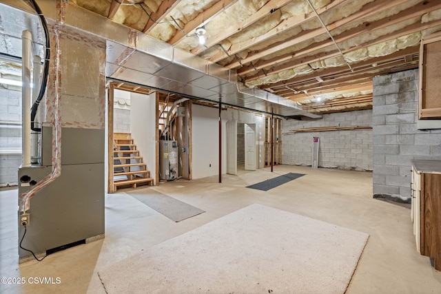 620 Sunset Dr, Bloomsburg, PA 17815 - unfinished below grade area featuring water heater, stairs, heating unit, and concrete block wall
