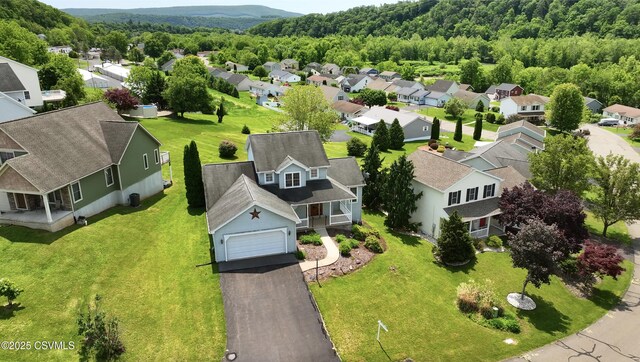 620 Sunset Dr, Bloomsburg, PA 17815 - aerial perspective of suburban area featuring a heavily wooded area