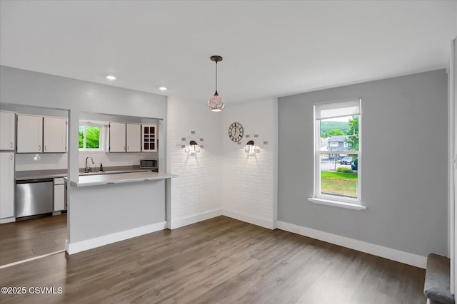 521 Church St, Danville, PA 17821 - kitchen with stainless steel appliances, a sink, dark wood finished floors, healthy amount of natural light, and brick wall