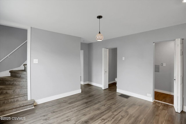 521 Church St, Danville, PA 17821 - unfurnished living room with wood finished floors, stairs, and baseboards
