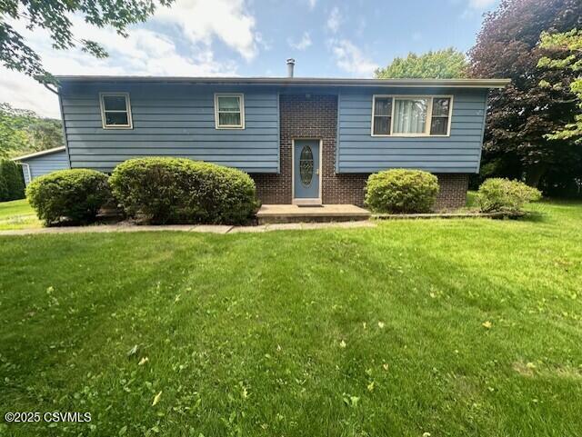 24 Boulder Ln, Berwick, PA 18603 - bi-level home with a front lawn and brick siding