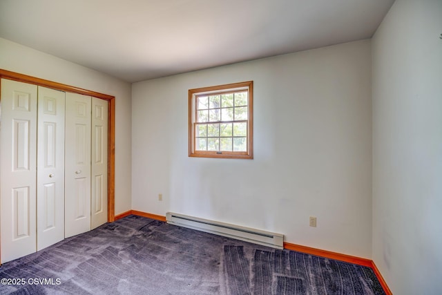162 Liberty Valley Rd, Danville, PA 17821 - unfurnished bedroom featuring a baseboard heating unit, a closet, and baseboards