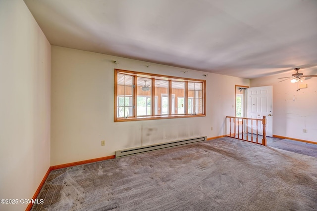 162 Liberty Valley Rd, Danville, PA 17821 - carpeted empty room featuring a baseboard heating unit, baseboards, and a ceiling fan