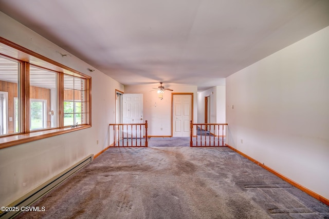 162 Liberty Valley Rd, Danville, PA 17821 - spare room featuring a baseboard radiator, carpet flooring, baseboards, and a ceiling fan