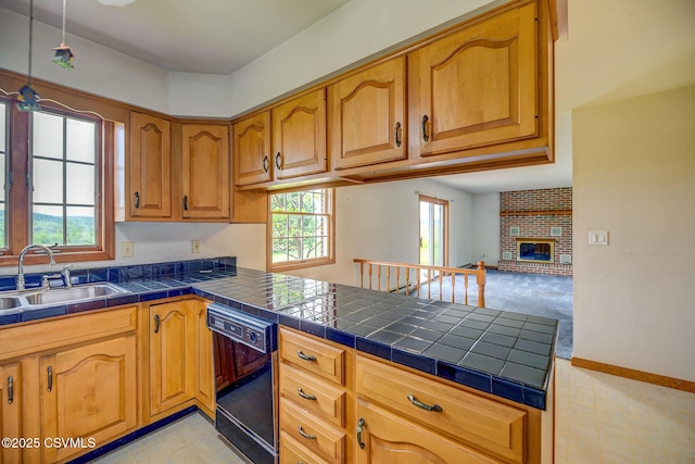 162 Liberty Valley Rd, Danville, PA 17821 - kitchen with dishwasher, a sink, a peninsula, brown cabinets, and a fireplace