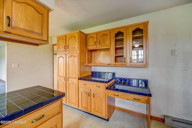 162 Liberty Valley Rd, Danville, PA 17821 - kitchen with baseboard heating, tile countertops, glass insert cabinets, and baseboards