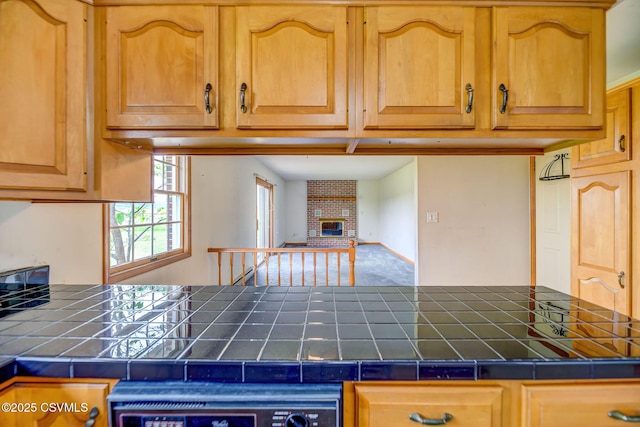 162 Liberty Valley Rd, Danville, PA 17821 - kitchen featuring tile counters and a fireplace