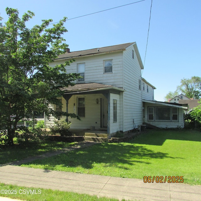 17 E Mill St, Selinsgrove, PA 17870 - view of front facade featuring a front lawn, covered porch, central AC unit, and a chimney