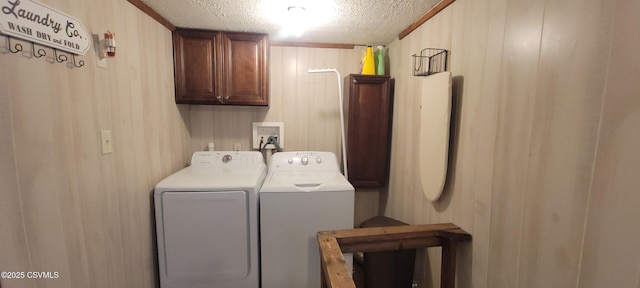 260 Iron St, Berwick, PA 18603 - washroom with separate washer and dryer, a textured ceiling, cabinet space, and wooden walls
