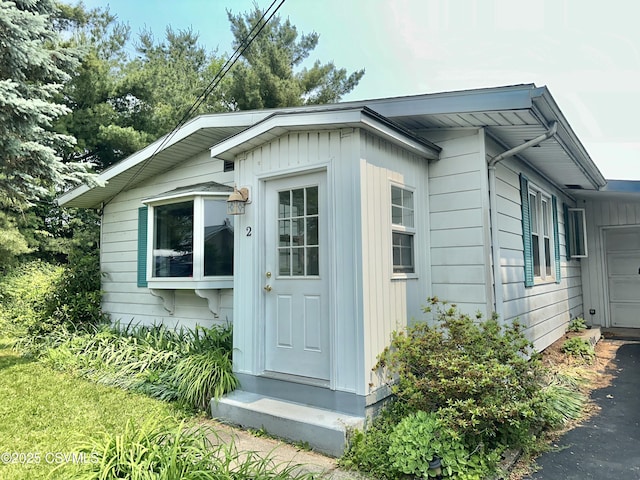 2 E 11th Ave, Shamokin Dam, PA 17876 - view of front of home with a garage, board and batten siding, and driveway