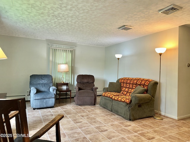 2 E 11th Ave, Shamokin Dam, PA 17876 - living room featuring a baseboard heating unit, light tile patterned floors, and baseboards