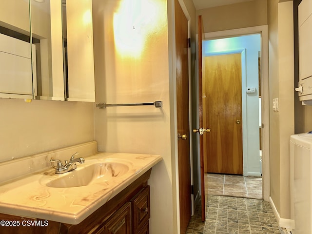 2 E 11th Ave, Shamokin Dam, PA 17876 - bathroom featuring vanity, washer / clothes dryer, and stone finish floors