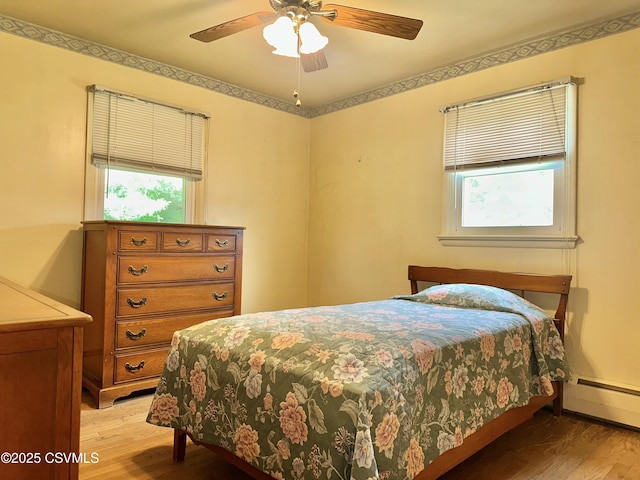 2 E 11th Ave, Shamokin Dam, PA 17876 - bedroom with light wood-style floors, baseboard heating, and a ceiling fan