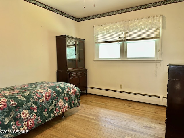 2 E 11th Ave, Shamokin Dam, PA 17876 - bedroom with a baseboard heating unit and hardwood / wood-style flooring