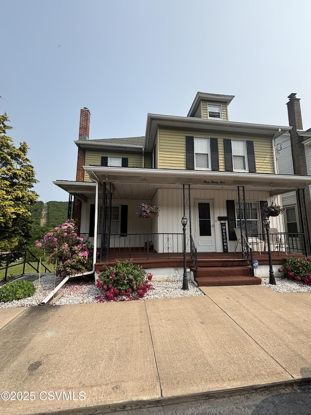 321 E Shamokin St, Trevorton, PA 17881 - view of front of house with covered porch and a chimney