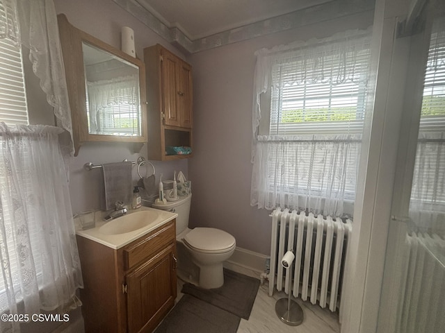 321 E Shamokin St, Trevorton, PA 17881 - bathroom with radiator heating unit, plenty of natural light, vanity, and toilet