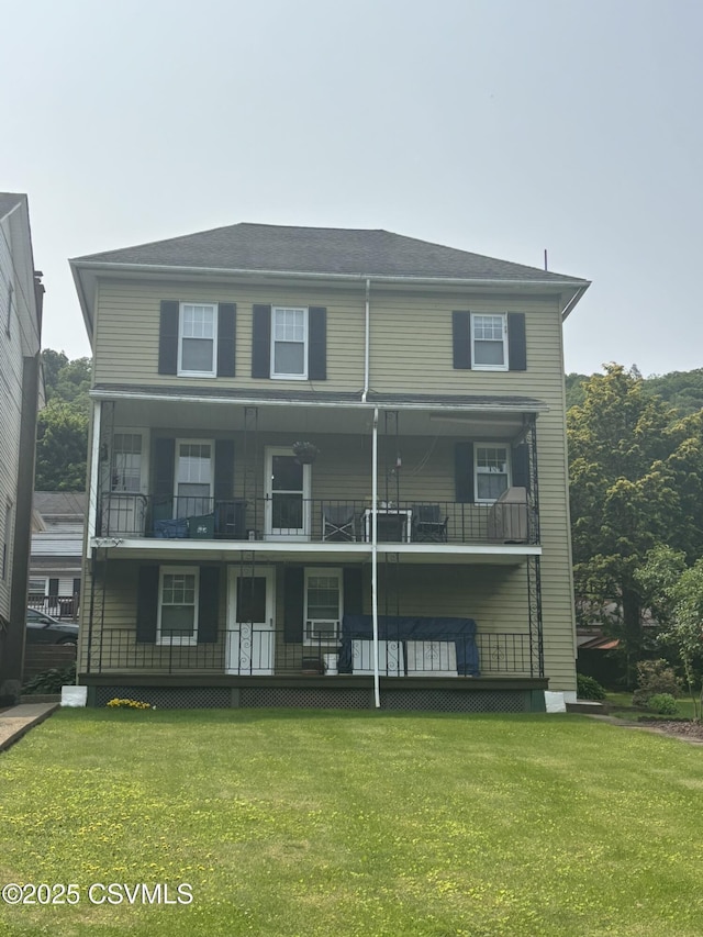 321 E Shamokin St, Trevorton, PA 17881 - view of front facade featuring a balcony, a front yard, and covered porch