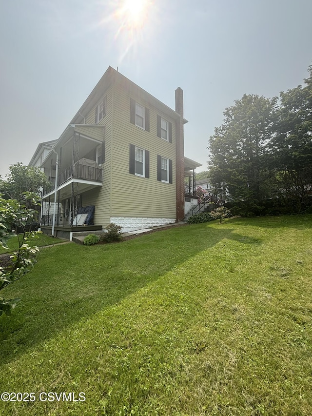321 E Shamokin St, Trevorton, PA 17881 - view of side of property featuring a chimney, a yard, and a balcony