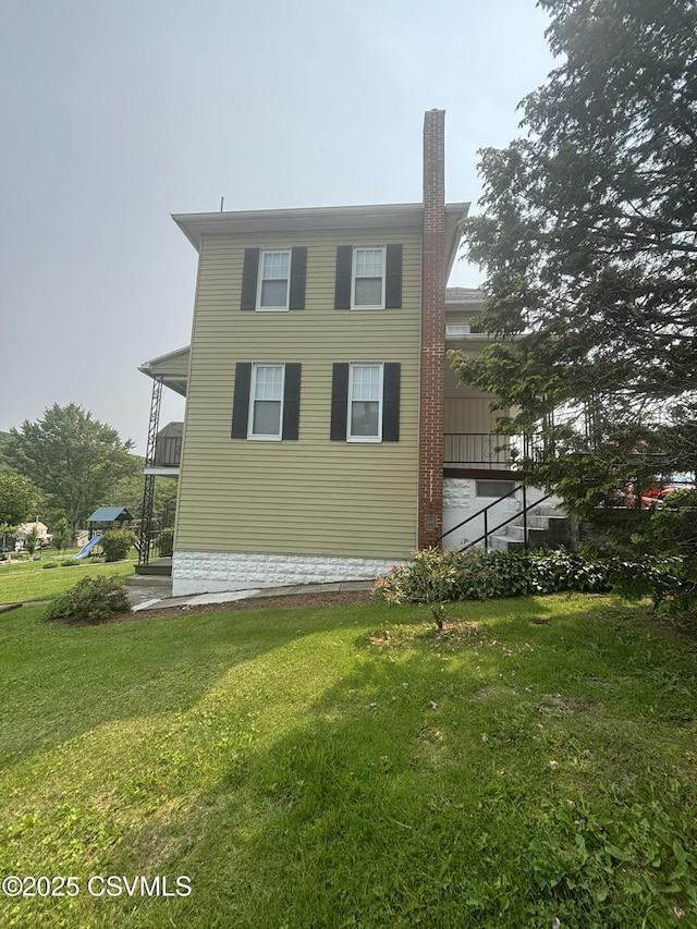 321 E Shamokin St, Trevorton, PA 17881 - view of side of property with a lawn and a chimney