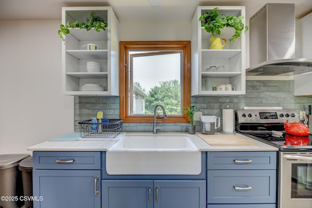 67 Center School Rd, Elysburg, PA 17824 - kitchen with open shelves, wall chimney range hood, stainless steel range with electric stovetop, a sink, and blue cabinetry