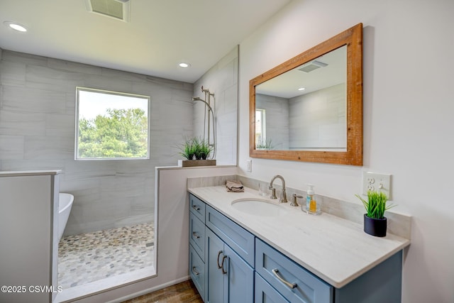 67 Center School Rd, Elysburg, PA 17824 - bathroom with vanity, tiled shower, and recessed lighting
