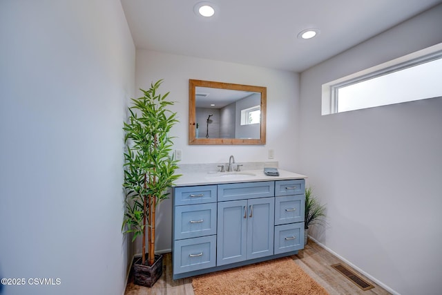 67 Center School Rd, Elysburg, PA 17824 - bathroom featuring wood finished floors, vanity, baseboards, and recessed lighting