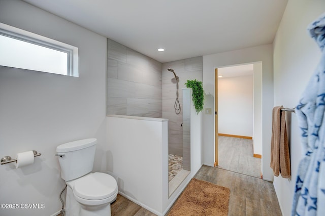67 Center School Rd, Elysburg, PA 17824 - bathroom featuring walk in shower, toilet, wood finished floors, recessed lighting, and baseboards