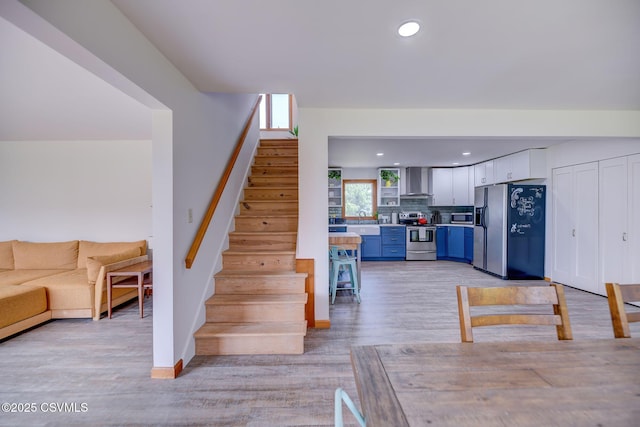 67 Center School Rd, Elysburg, PA 17824 - dining room with stairs, light wood-style floors, baseboards, and recessed lighting