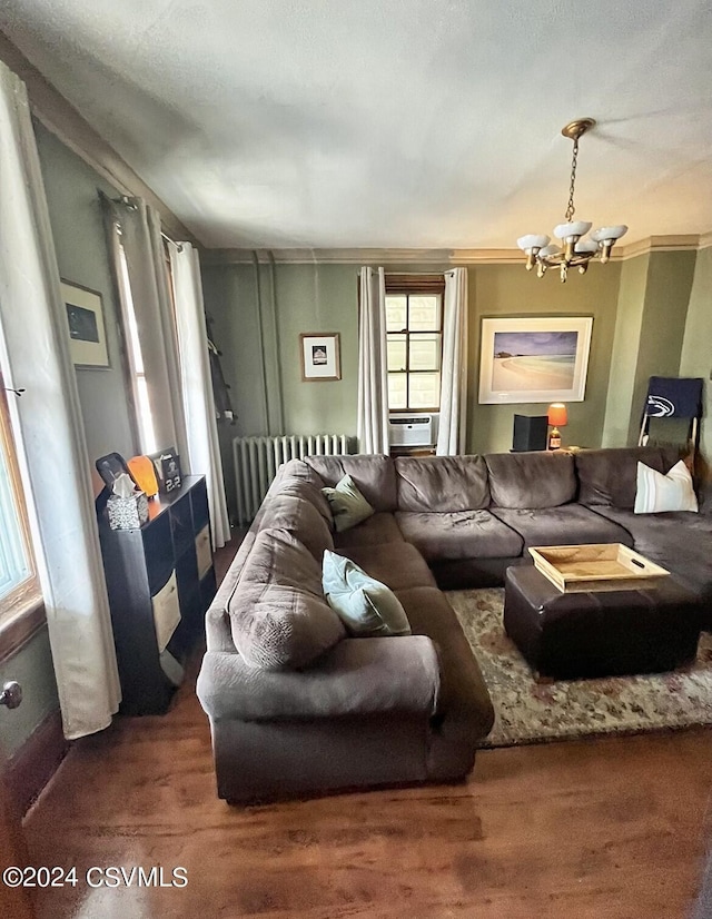 406 W Spruce St, Shamokin, PA 17872 - living room featuring a chandelier, radiator heating unit, and wood finished floors