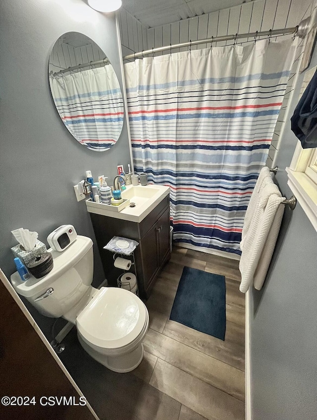 406 W Spruce St, Shamokin, PA 17872 - full bath with wood finished floors, toilet, vanity, and curtained shower