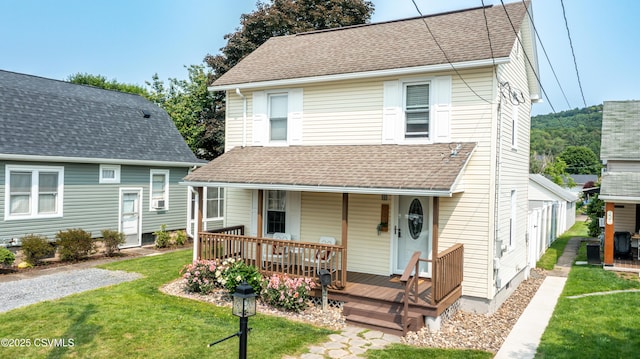 221 Charles St, Berwick, PA 18603 - view of front facade featuring a front lawn, a porch, and roof with shingles