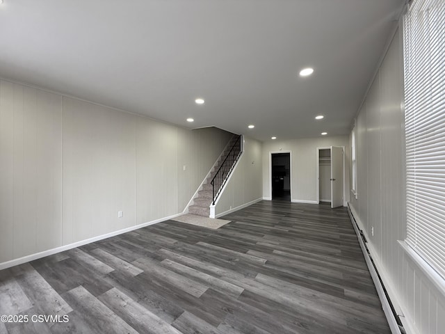 423 E Dewart St, Shamokin, PA 17872 - unfurnished living room with stairway, baseboard heating, dark wood-type flooring, recessed lighting, and baseboards