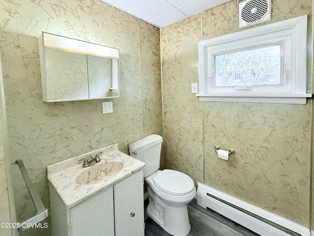 423 E Dewart St, Shamokin, PA 17872 - half bath featuring a baseboard heating unit, toilet, and vanity