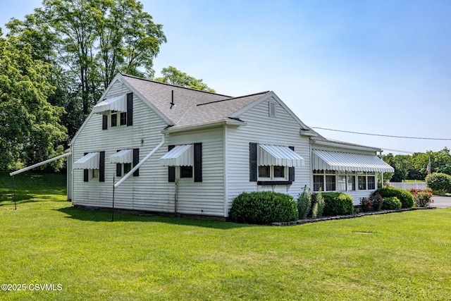776 Continental Blvd, Danville, PA 17821 - view of side of property with roof with shingles and a lawn