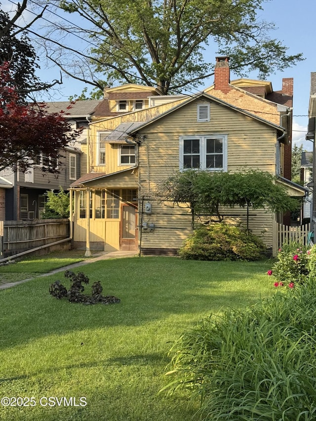127 N 3rd St, Lewisburg, PA 17837 - back of house featuring a chimney