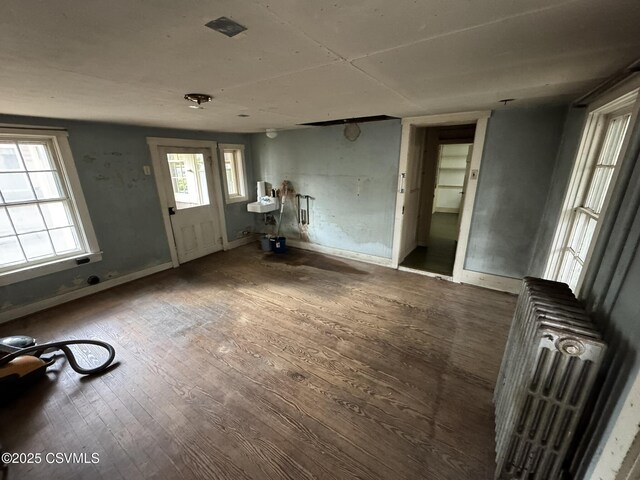 127 N 3rd St, Lewisburg, PA 17837 - foyer with radiator, wood finished floors, and baseboards