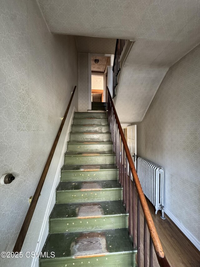127 N 3rd St, Lewisburg, PA 17837 - staircase featuring wood finished floors, baseboards, and wallpapered walls