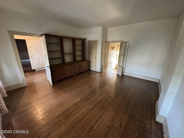 127 N 3rd St, Lewisburg, PA 17837 - unfurnished bedroom with dark wood-style flooring and baseboards