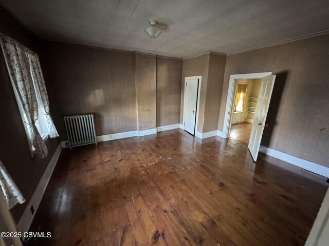 127 N 3rd St, Lewisburg, PA 17837 - unfurnished bedroom featuring radiator, dark wood-type flooring, crown molding, and baseboards