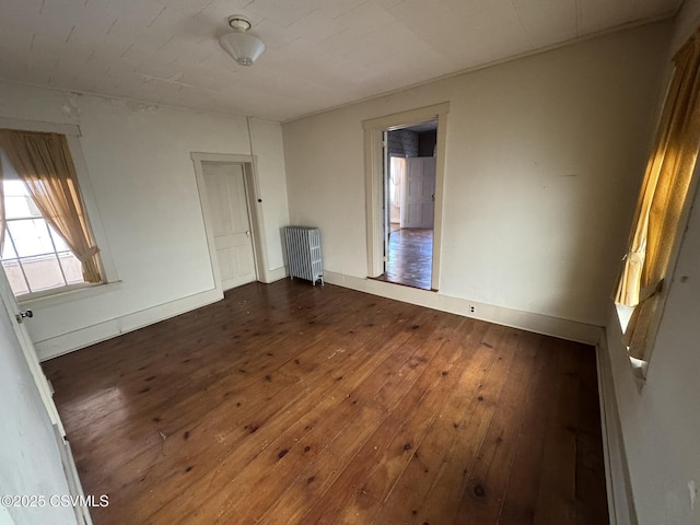 127 N 3rd St, Lewisburg, PA 17837 - empty room featuring radiator heating unit, dark wood finished floors, and baseboards