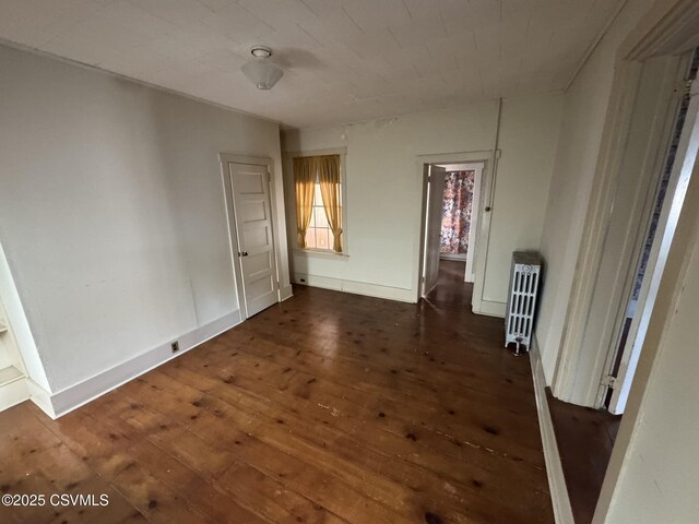 127 N 3rd St, Lewisburg, PA 17837 - spare room featuring hardwood / wood-style floors, radiator heating unit, and baseboards