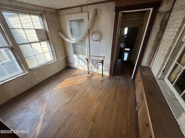 127 N 3rd St, Lewisburg, PA 17837 - empty room featuring wood-type flooring and a textured ceiling