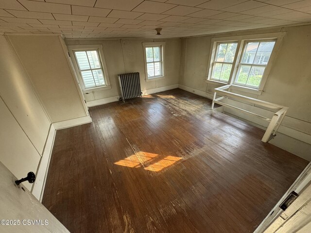 127 N 3rd St, Lewisburg, PA 17837 - unfurnished living room with radiator and wood-type flooring