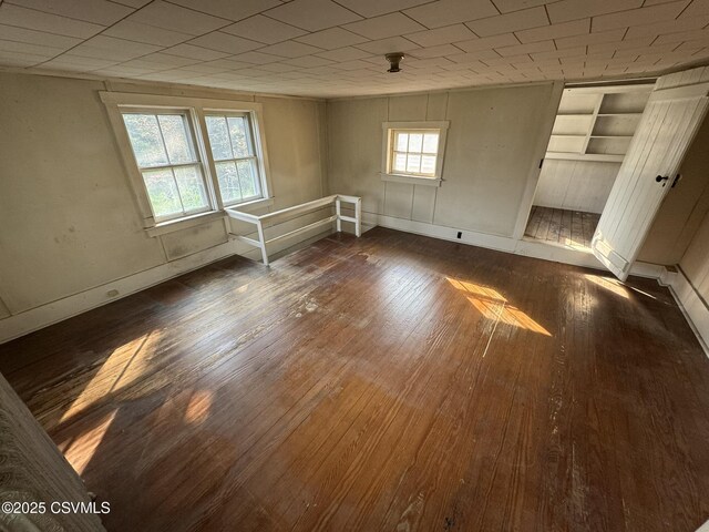 127 N 3rd St, Lewisburg, PA 17837 - empty room featuring hardwood / wood-style flooring, baseboards, and built in shelves