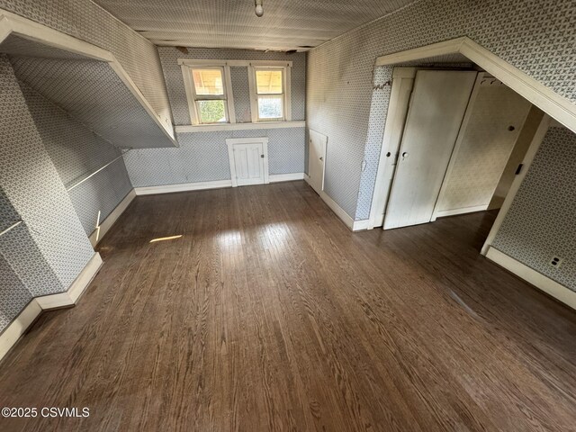 127 N 3rd St, Lewisburg, PA 17837 - additional living space with wood finished floors, wallpapered walls, and baseboards