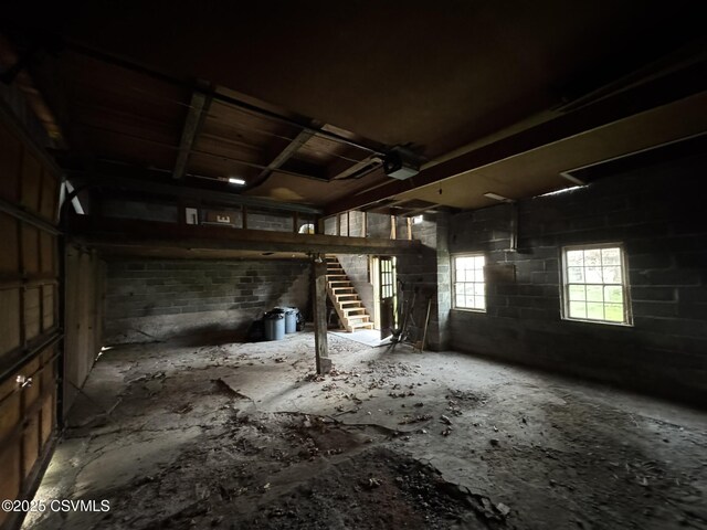 127 N 3rd St, Lewisburg, PA 17837 - garage featuring concrete block wall and a garage door opener