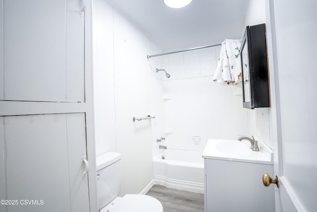 1355 Salem Blvd, Berwick, PA 18603 - bathroom with toilet, vanity, wood finished floors, and shower / washtub combination
